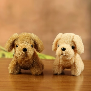 Curly plush Teddy dog keychains in dark brown and khaki colors on a wooden surface