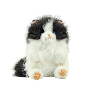 Plush long-hair tuxedo cat doll with blue eyes and realistic sitting pose on white background
