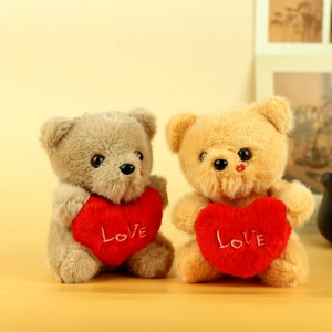 Plush teddy bear charms in light brown and tan holding red hearts with Love embroidery