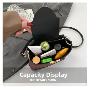 Interior storage capacity view showing a smartphone and cosmetics in a quilt handbag