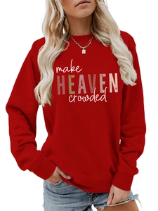 Close-up of the vintage 'make HEAVEN crowded' slogan print on a red cotton sweatshirt