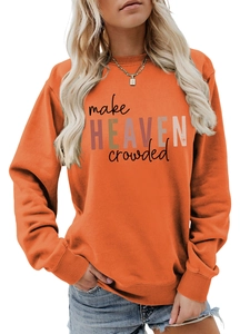 Detail of orange crewneck sweatshirt with 'make HEAVEN crowded' slogan and ribbed cuffs