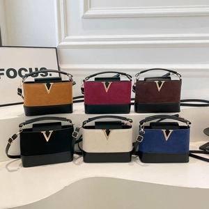 Minimalist crossbody handbags in six colors with metallic V-shaped buckle hardware