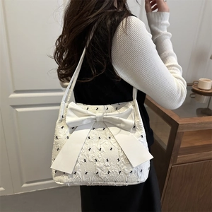 White jacquard shoulder bag with large bow and mini black butterfly patterns