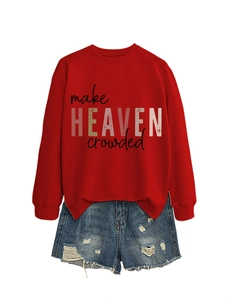 Detail of red crewneck sweatshirt with Make Heaven Crowded print and distressed denim shorts