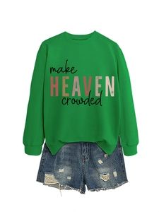 Detail of green hoodie with 'Make Heaven Crowded' text and ripped denim shorts