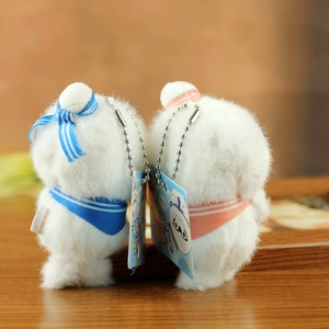 Detail of plush seal pendants in sailor style with soft faux fur and silver bead chains