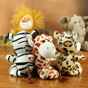 Detailed view of plush jungle animal keychains with zebra, giraffe, and leopard patterns