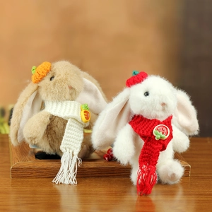 Cute plush bunny keychain set with knitted strawberry and pumpkin hats on wood base