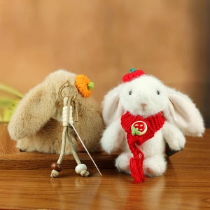 Cute plush rabbit keychain set with white and brown bunnies in red winter outfits