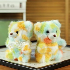 Pair of colorful tie-dye plush teddy bears with lace collar on a warm home background