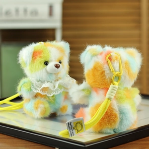 Set of two colorful tie-dye teddy bear plush keychains with lace collar and yellow lanyards