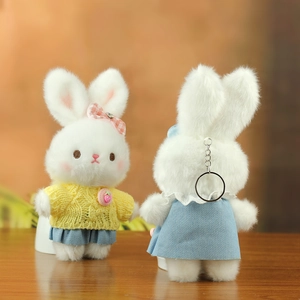 Detail view of plush bunny keychain showing front and back with silver metal ring