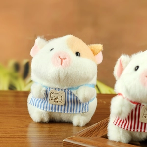 Detailed view of two plush guinea pig charms with soft fur and cute striped aprons