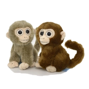 Set of two cute plush monkey toys in grey-green and brown colors with long tails