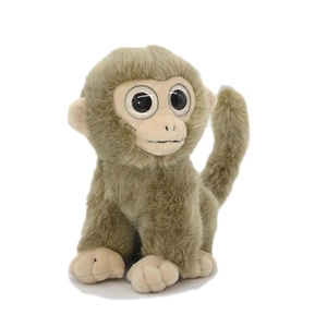 Cute monkey plush toy with big eyes and a long curly tail in a seated pose