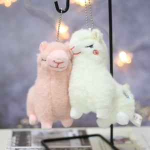 Cute pink and white plush alpaca keychains with soft faux fur and embroidered details