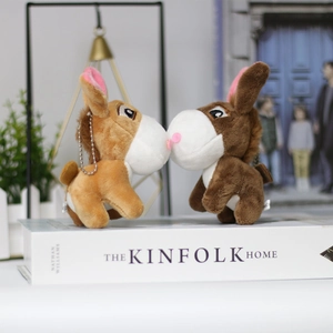 Plush donkey couple keychains in light and dark brown with magnetic kissing feature
