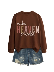 Detail of Make Heaven Crowded brown sweatshirt paired with distressed denim shorts