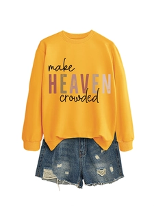 Flat lay of yellow long sleeve sweatshirt with Make Heaven Crowded text and denim shorts