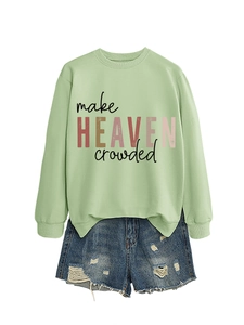 Flat lay of light green sweatshirt with make heaven crowded print and denim shorts