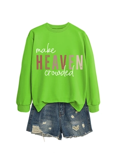Detail of green long sleeve sweatshirt with make HEAVEN crowded print and ripped denim shorts