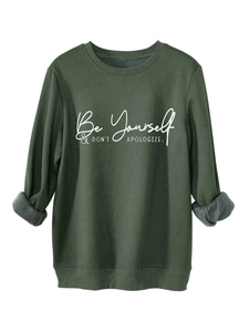 Detail of forest green sweatshirt showing warm gray fleece lining and ribbed cuffs