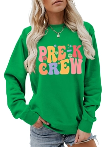 Close-up of vibrant green crewneck sweatshirt featuring colorful PRE-K CREW artistic typography