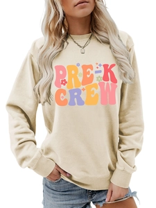 Detailed close-up of cream crewneck sweatshirt featuring colorful PRE-K CREW artistic print