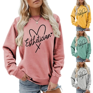 Detail of soft knit Esthetician sweatshirt with heart line art in four pastel colors