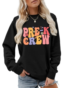 Detail of ribbed cuffs and Pre-K Crew colorful graphic on black sweatshirt for women