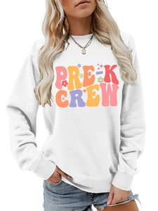 Detail shot of the Pre-K Crew print with colorful flowers on a white cotton sweatshirt