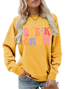 Detail of Pre-K Crew lettering on comfortable yellow crewneck sweatshirt for women