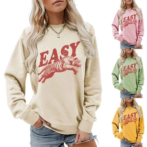 Detail of tiger print sweatshirt showing beige, pink, green, and yellow color options