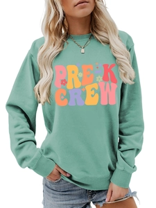 Detail of mint green sweatshirt with retro Pre-K Crew lettering and colorful floral motifs
