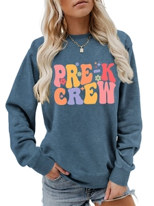 Detailed close-up of teal Pre-K Crew sweatshirt with colorful vintage print and round neck