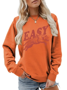 Close-up of the orange sweatshirt's ribbed crew neck and tiger print with EASY letters