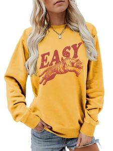 Detail of ribbed cuffs and collar on yellow cotton sweatshirt with tiger graphic
