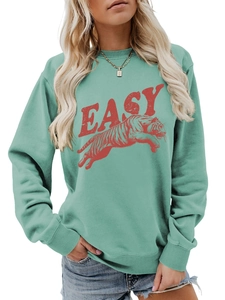 Close-up of tiger print and red EASY text on mint green crewneck sweatshirt
