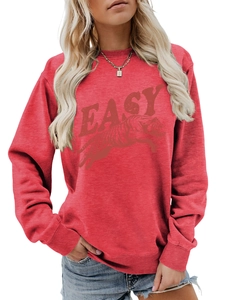Close-up of red crewneck sweatshirt with vintage Easy tiger graphic and ribbed cuffs