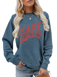 Close-up of fog blue sweatshirt featuring red tiger print and EASY typography detail