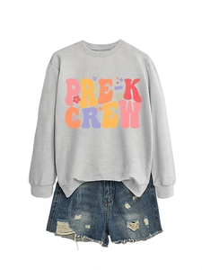 Flat lay of Pre-K Crew gray sweatshirt and distressed denim shorts school outfit