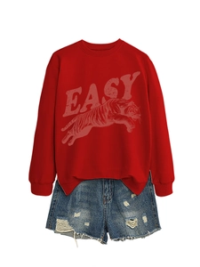 Detail of red crewneck sweatshirt featuring a graphic tiger print and bold EASY lettering