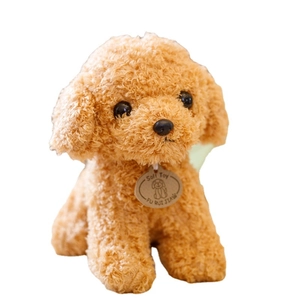 Realistic light brown teddy dog plush toy with soft curly fur and a small round neck tag