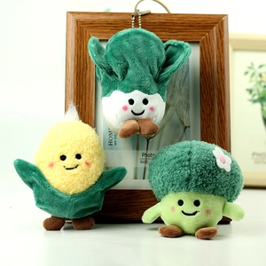 Detailed plush vegetable charms including corn, broccoli, and cabbage with embroidery