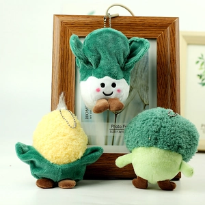 Detail of plush vegetable keychains including corn cabbage and broccoli with metal chains