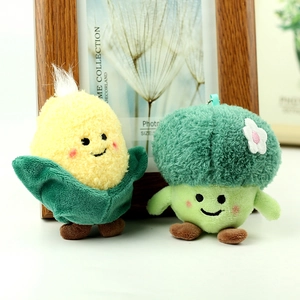 Detail of plush vegetable pendants with broccoli and corn shapes and fine embroidery