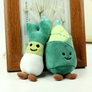 Detailed view of plush vegetable pendants featuring scalloped green onion and bamboo shoot