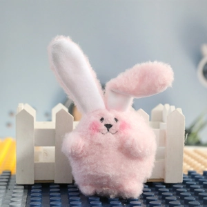 Fluffy pink plush bunny pendant with floppy ears for wedding gifts and event favors