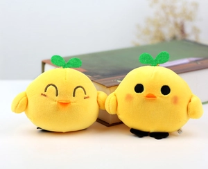 Cute yellow plush chick keychains with green sprouts and expressive cartoon faces